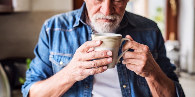 Man smelling coffee