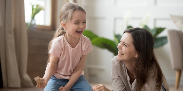 Mom playing with child