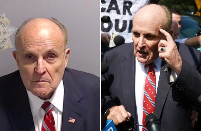 Rudy Giuliani forced to pose for a mugshot