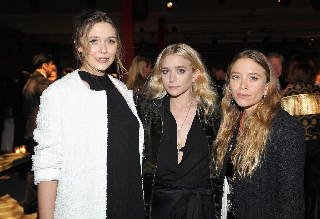 Actress Elizabeth Olsen and child actors and fashion designers Ashley and Mary-Kate Olsen.