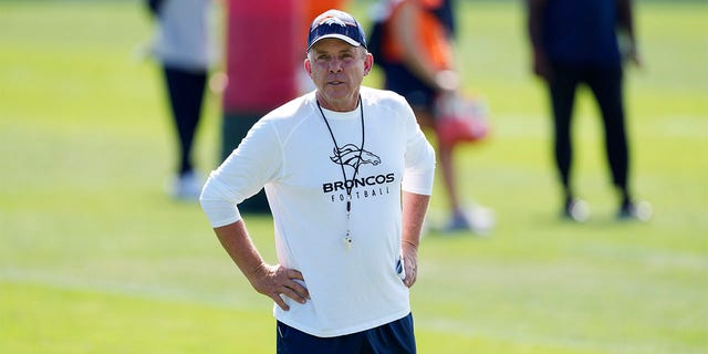 Sean Payton looks on at training camp