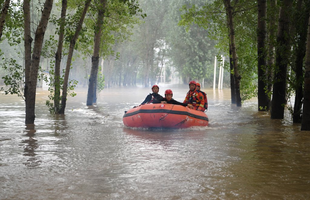 Rescuers head towards Shawo Village of Matou Town to carry out rescue operation in Zhuozhou, north China's Hebei Province, on Aug. 3, 2023. 