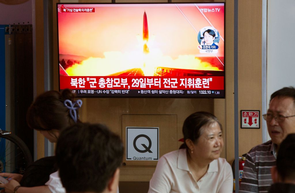 People watch a news report concerning a recent North Korean missile launch, at a station in Seoul, South Korea, on Aug. 31, 2023. 