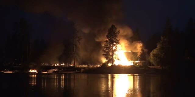 Gray Fire burning near lake