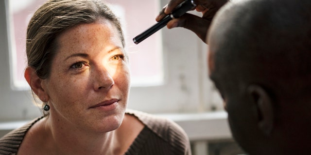 Woman at eye doctor