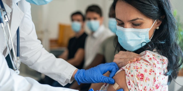 Woman getting vaccine