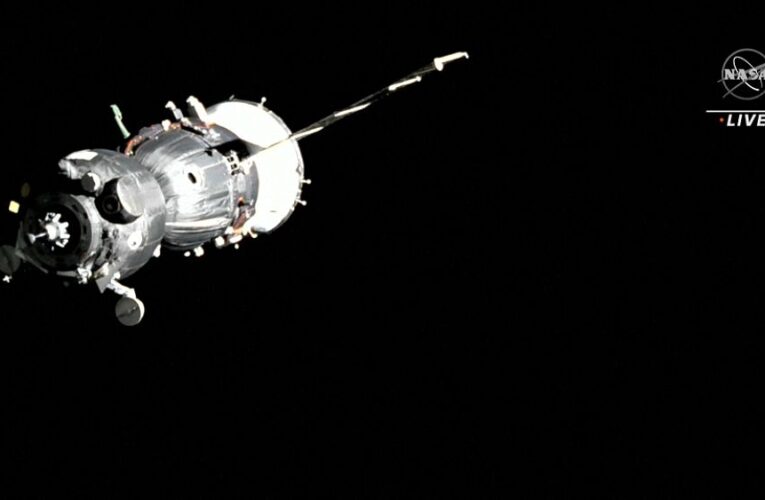 An astronaut and two cosmonauts arrive at the International Space Station