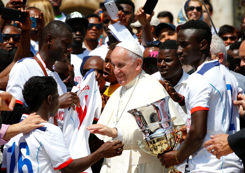 Pope Francis greets a group of migrants during his Wednesday general audience in Saint Peter's Square at the Vatican June 8, 2016.