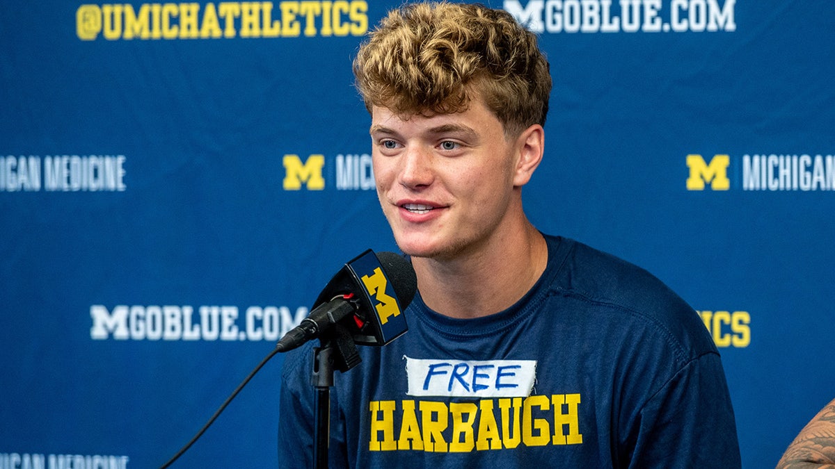 JJ McCarthy wears 'Free Harbaugh' shirt