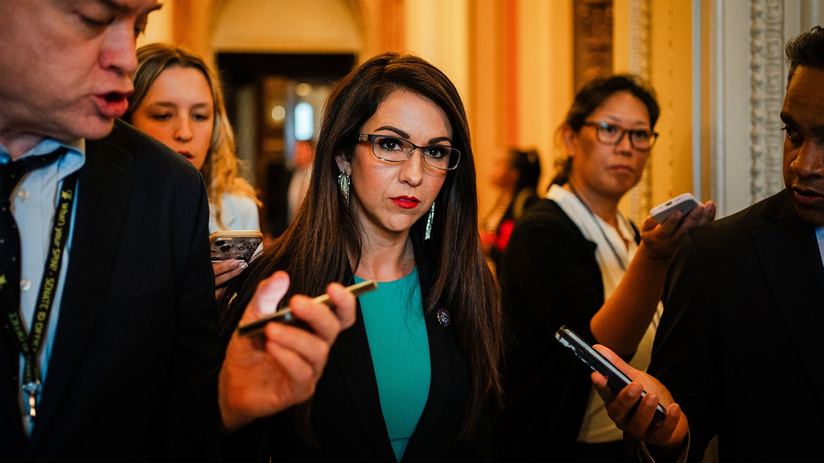 Lauren Boebert speaks with reporters