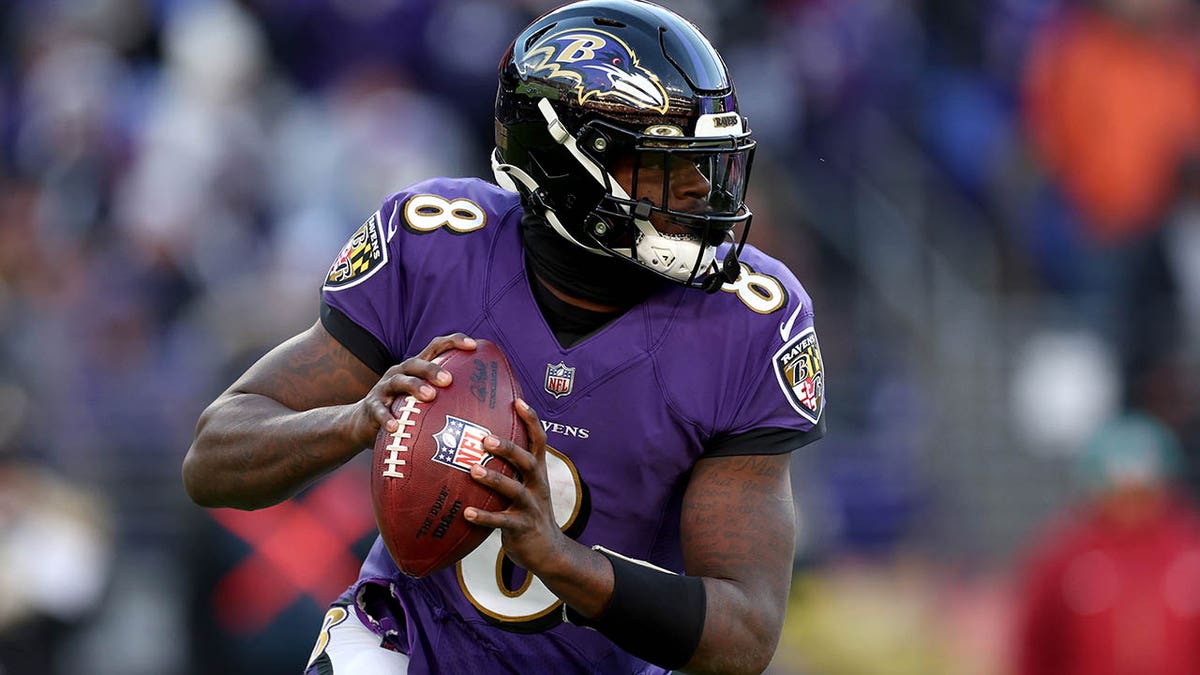 Lamar Jackson looks to throw