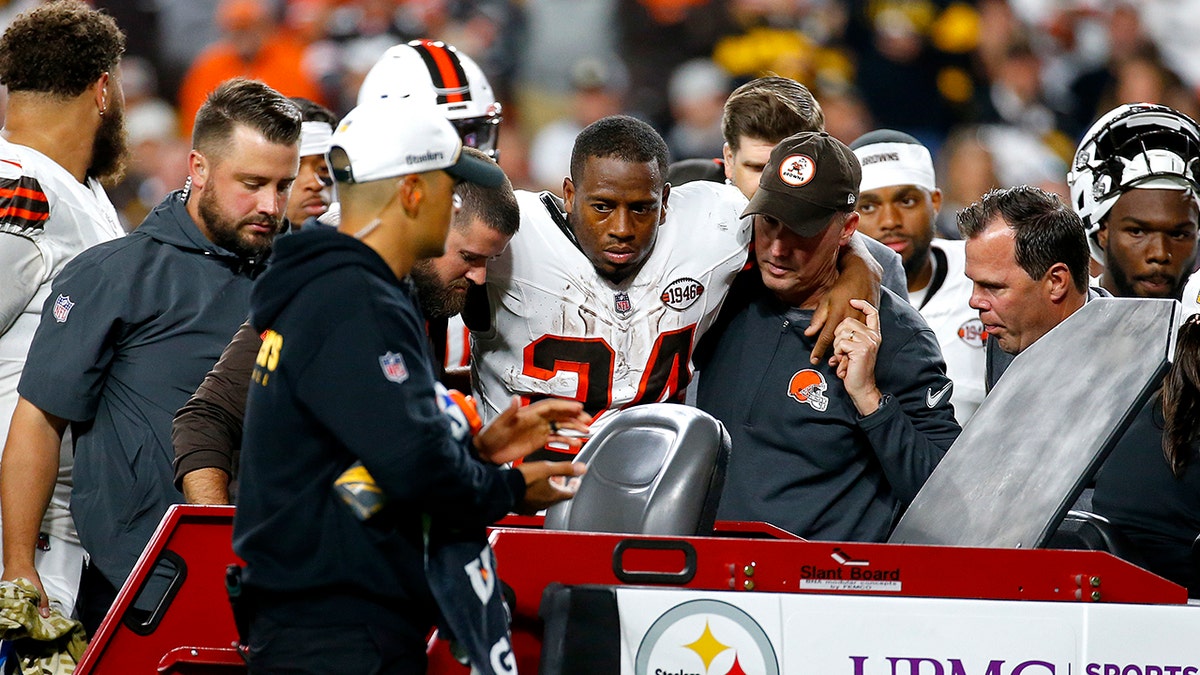 Nick Chubb helped onto cart