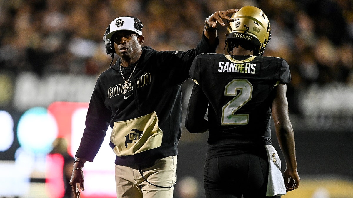 Deion Sanders celebrates with his son