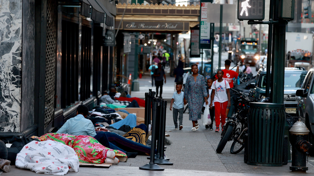 migrants outside Roosevelt Hotel in New York City