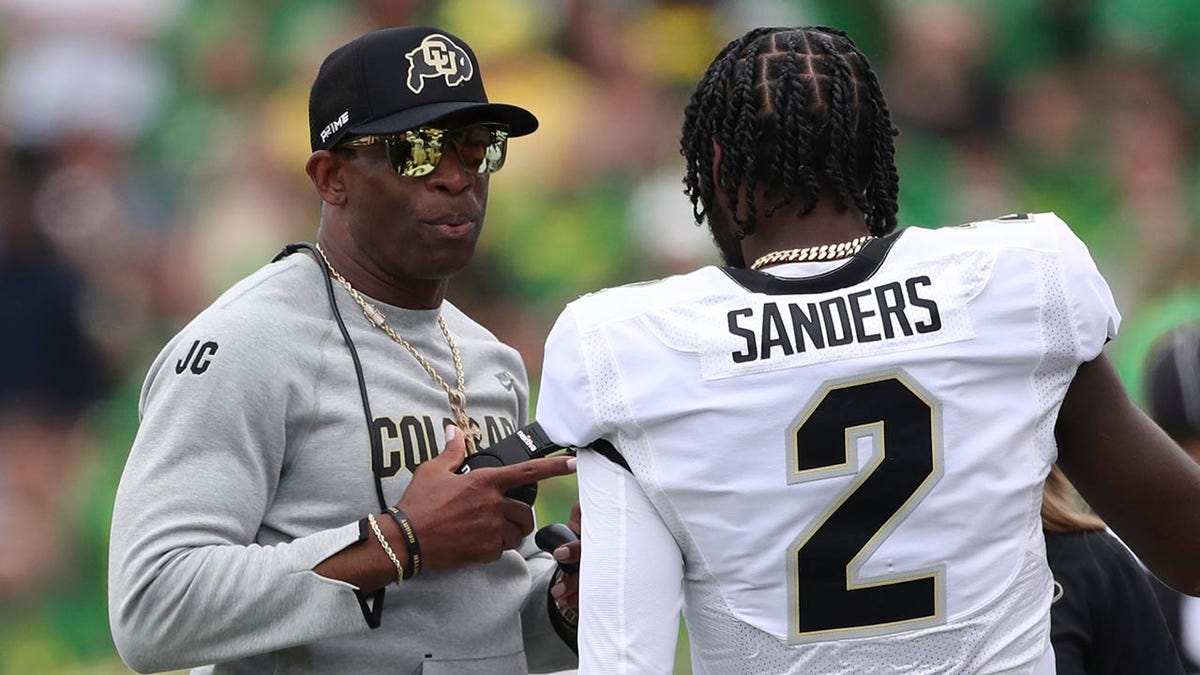 Deion Sanders talks to Shedeur Sanders