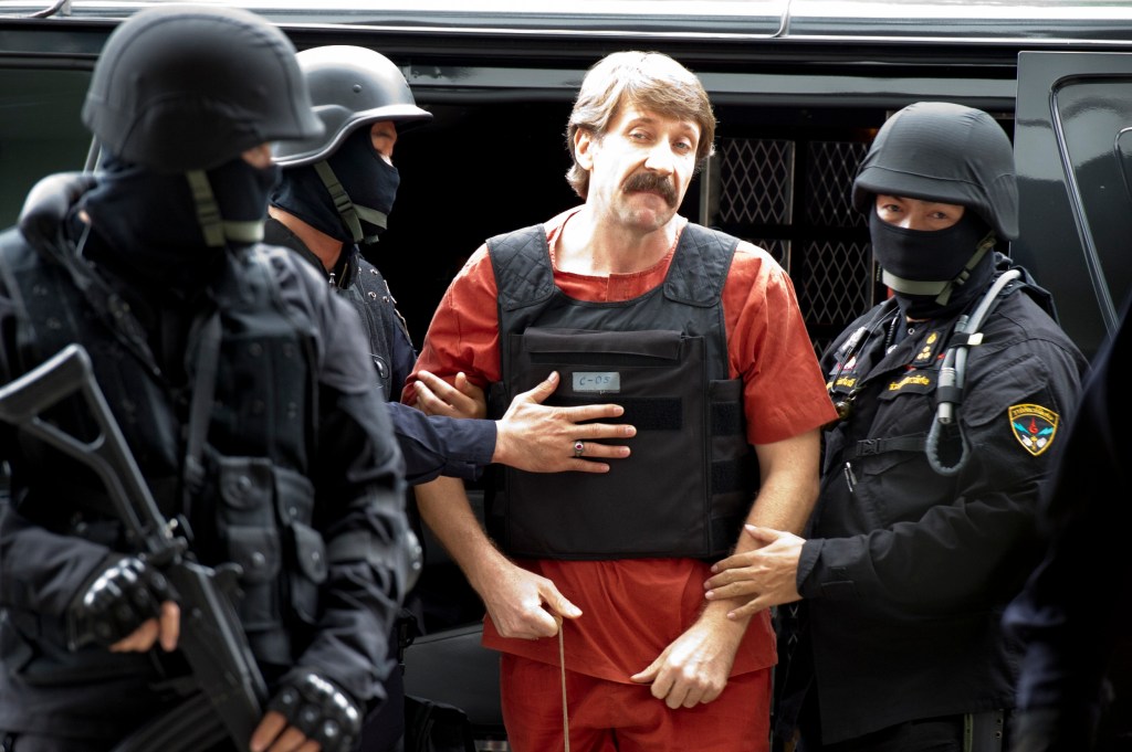 VIKTOR BOUT, also known as 'Merchant of Death', is escorted by special police unit as he arrives at the Ratchada criminal court in Bangkok for important hearing that could determine if he will be extradited to the United State.