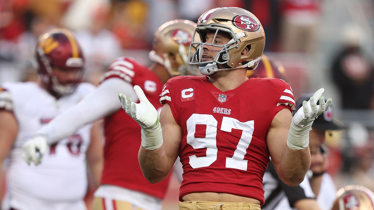 Nick Bosa celebrates on Christmas Eve