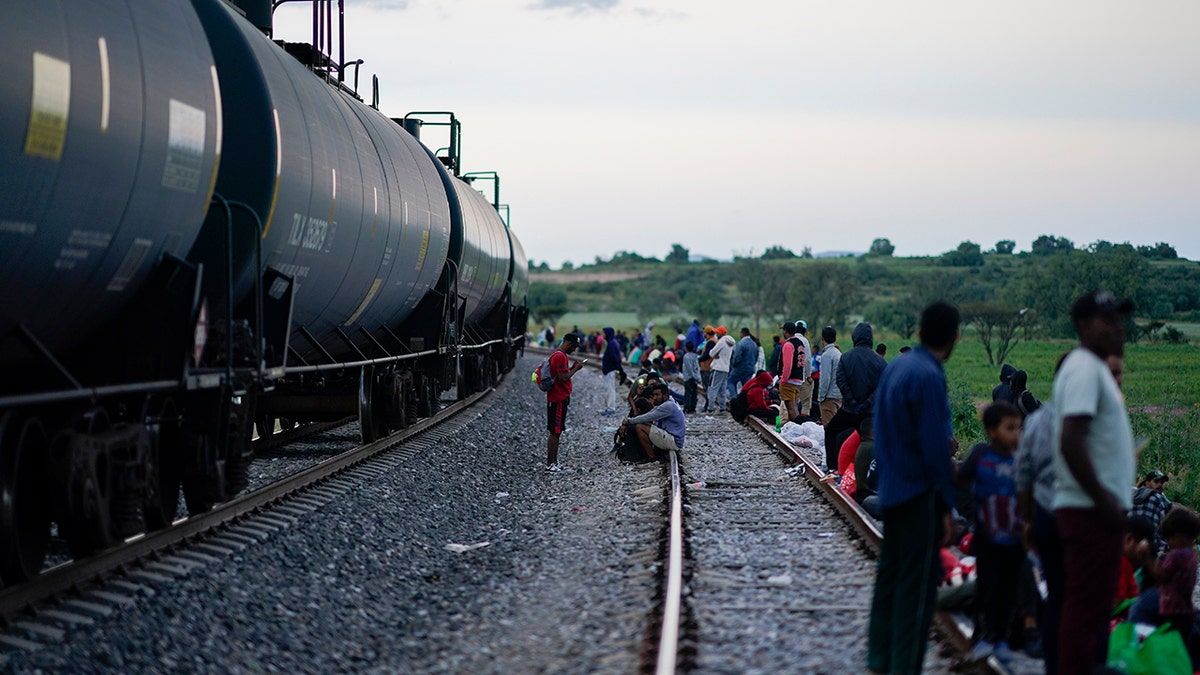 A freight car, migrants