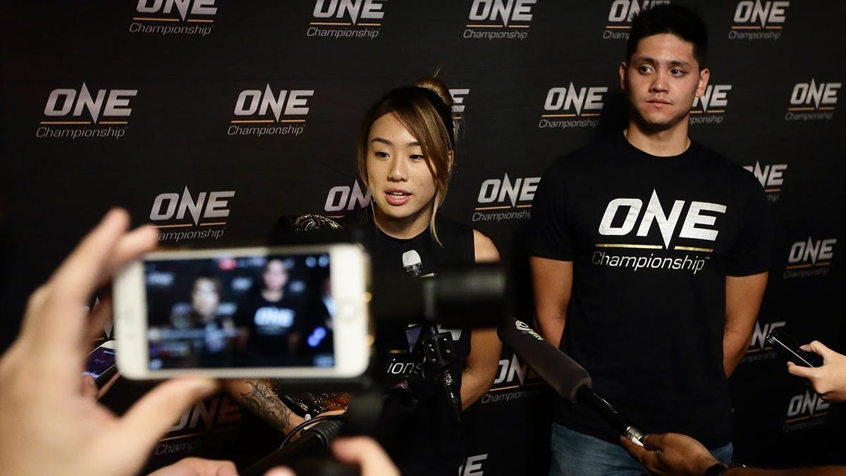 Angela Lee talks to the press