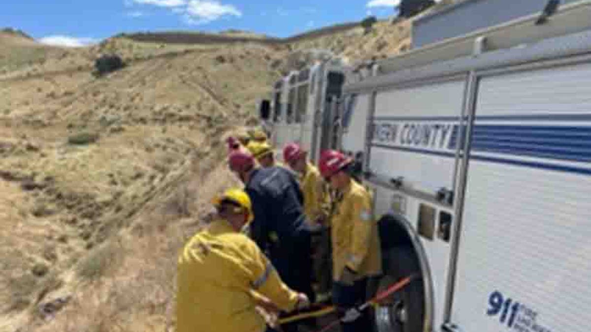 fire personnel along dirt road