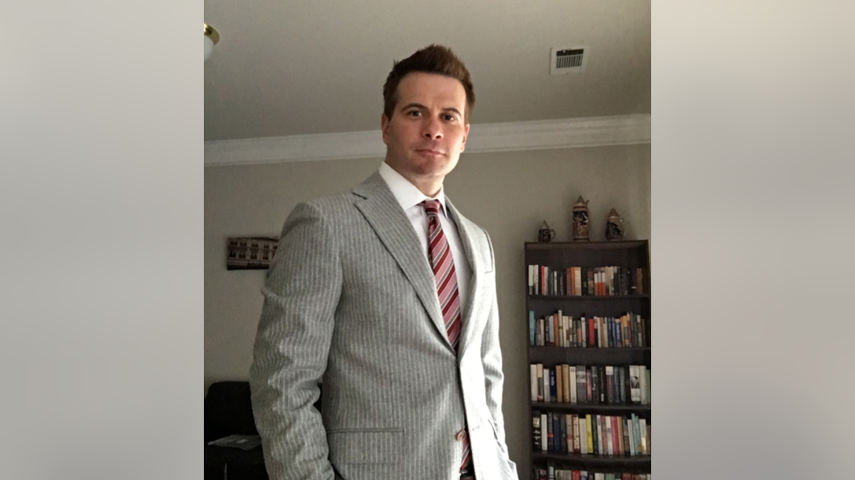 Man in gray suit and red tie