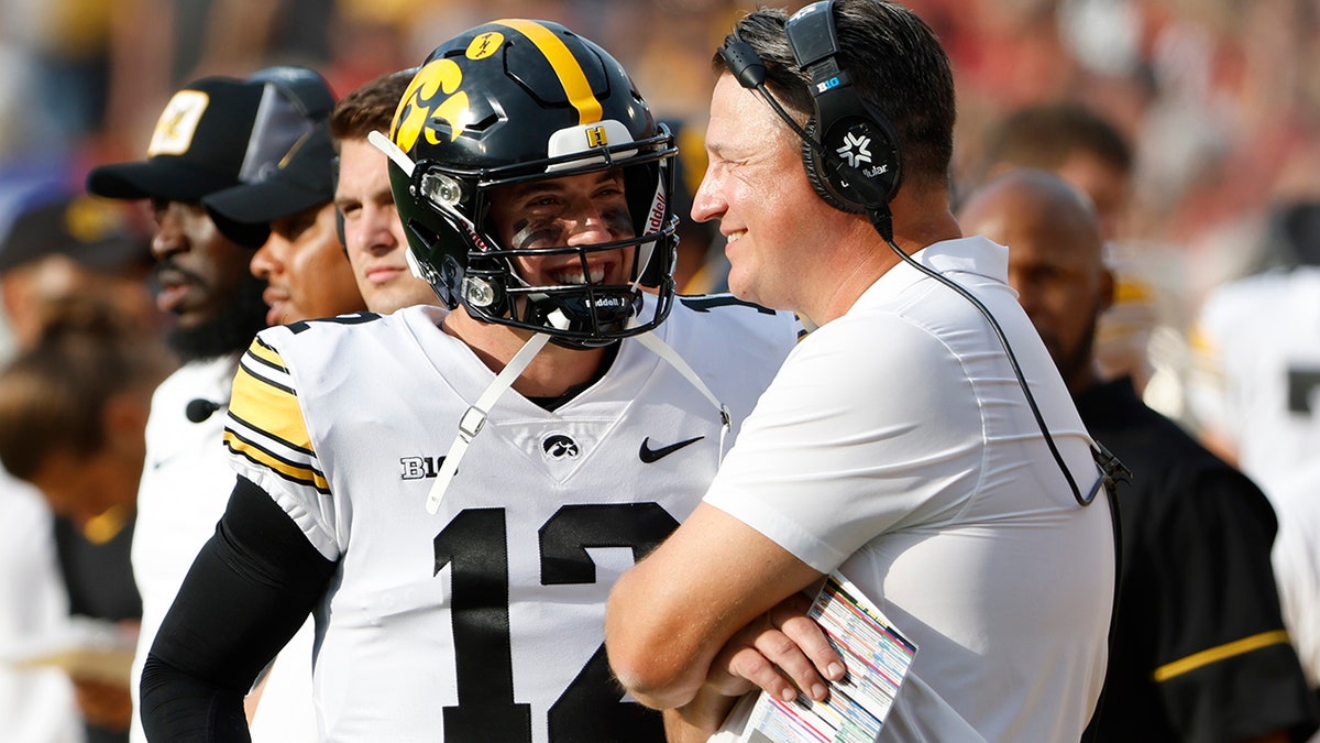 Cade McNamara and Brian Ferentz