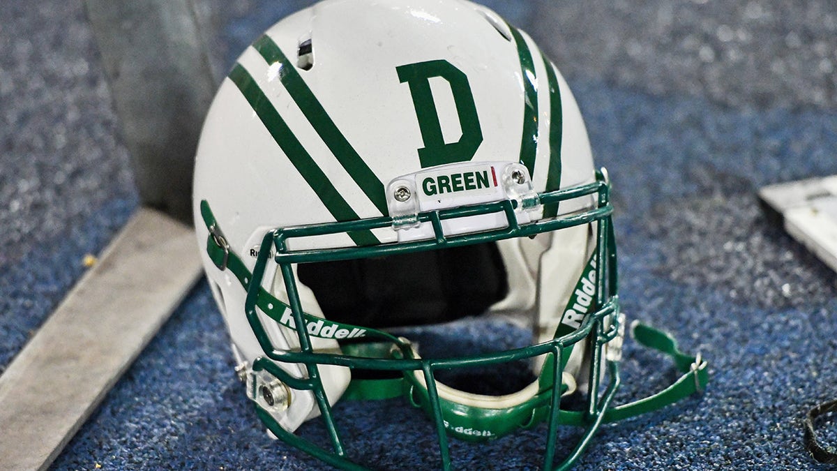 Dartmouth Football helmet sits on the turf