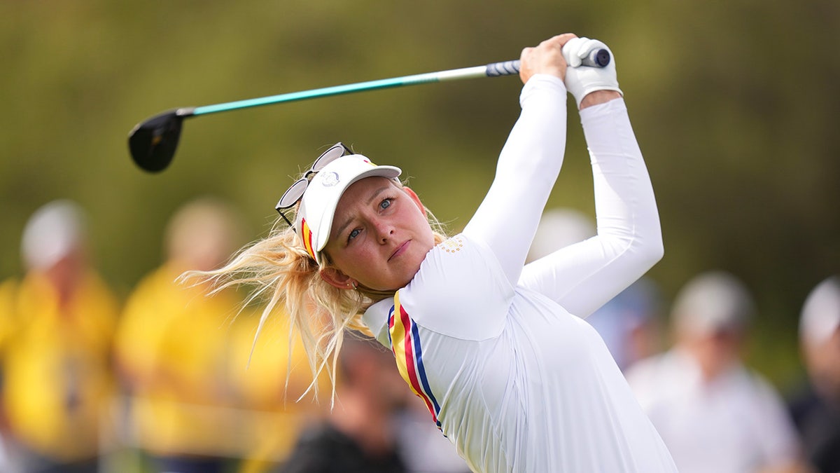 Emily Kristine Pedersen finishes golf swing