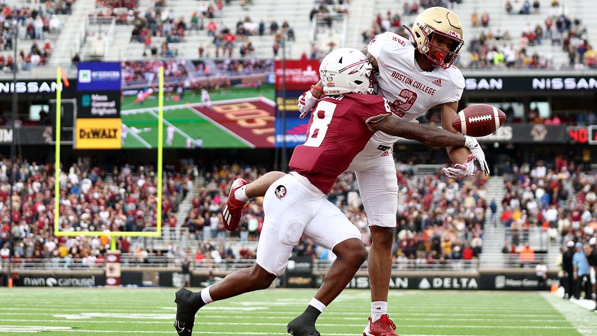 Florida State player defends a pass