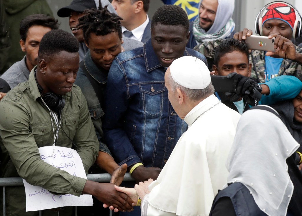 Pope Francis arrives at a regional migrant center to meet youths from Africa, in Bologna, Italy, Sunday, Oct. 1, 2017. 
