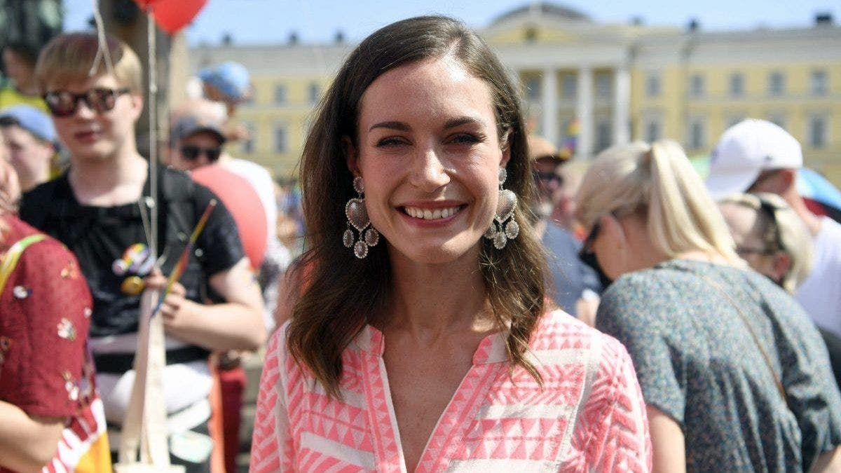 Sanna Marin in pink dress outdoors