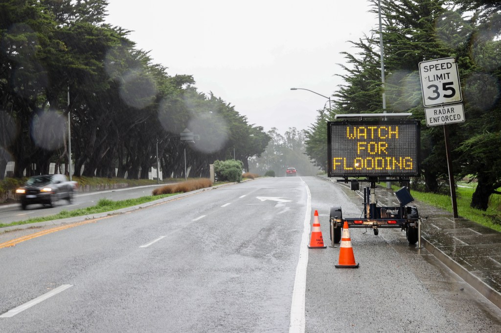 A warning sign sits on the side of highway 92 West in Half Moon Bay on December 31, 2022.