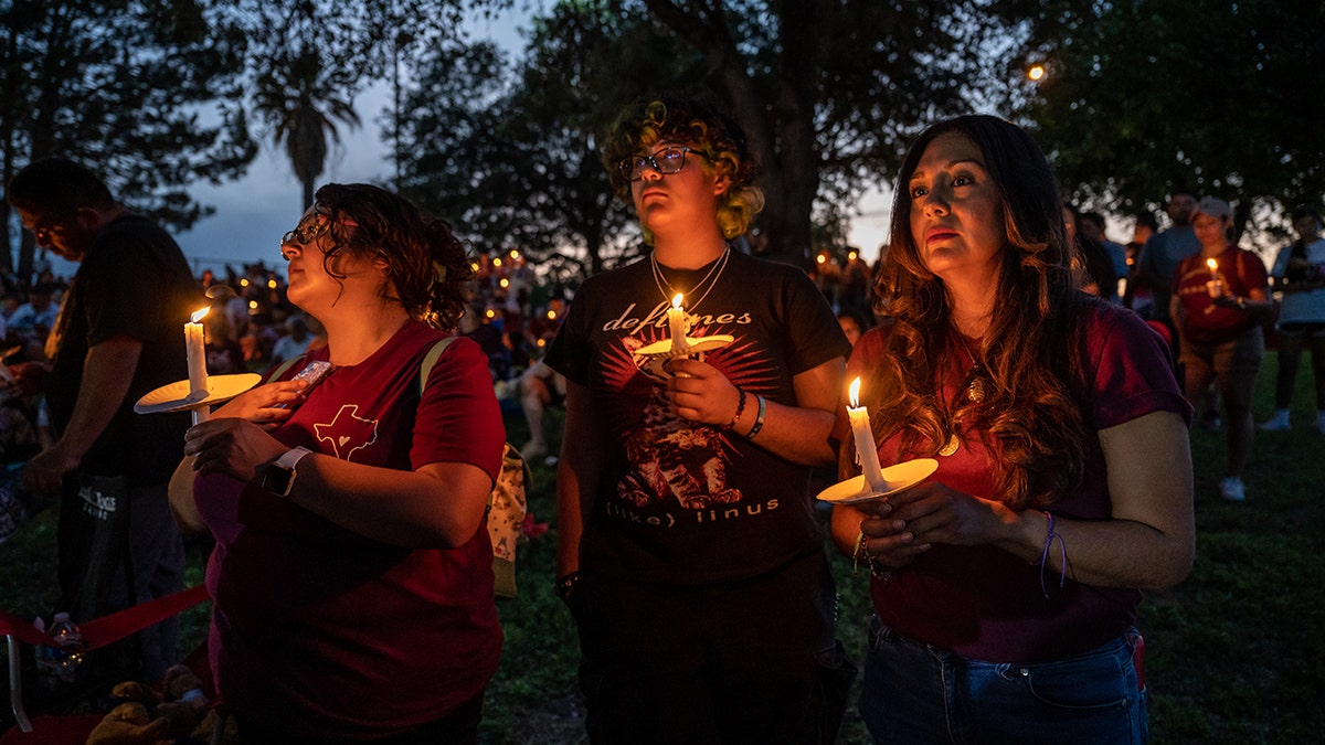 People holding candles