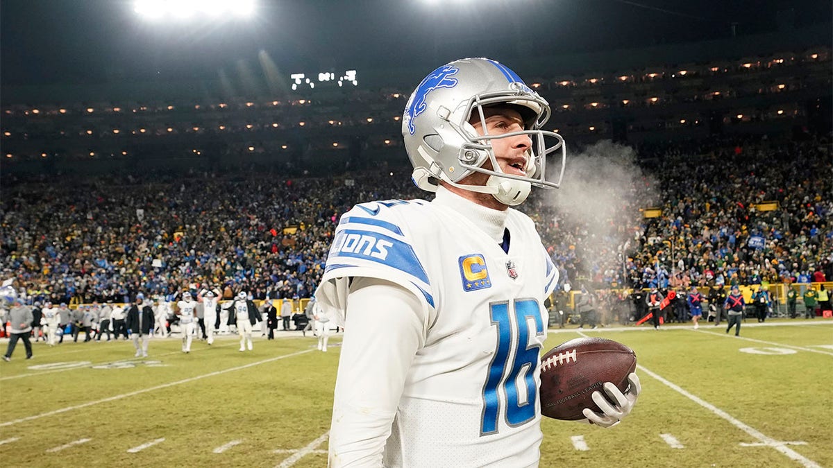 Jared Goff celebrates beating the Packers