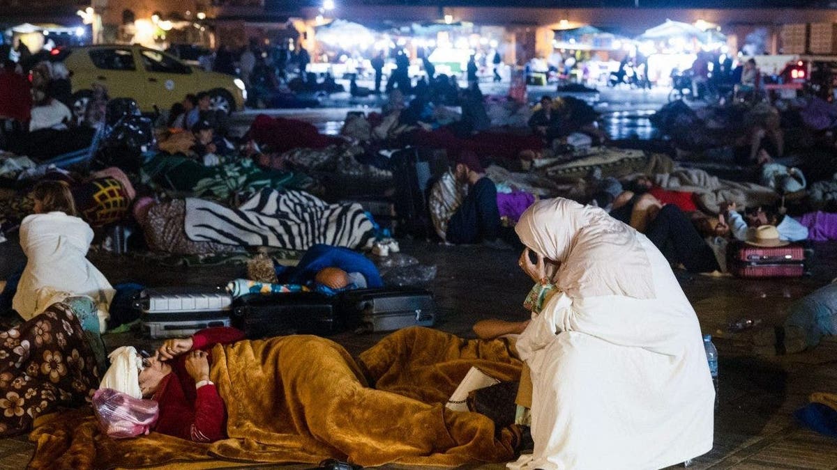 Moroccan citizens huddle in street following quake