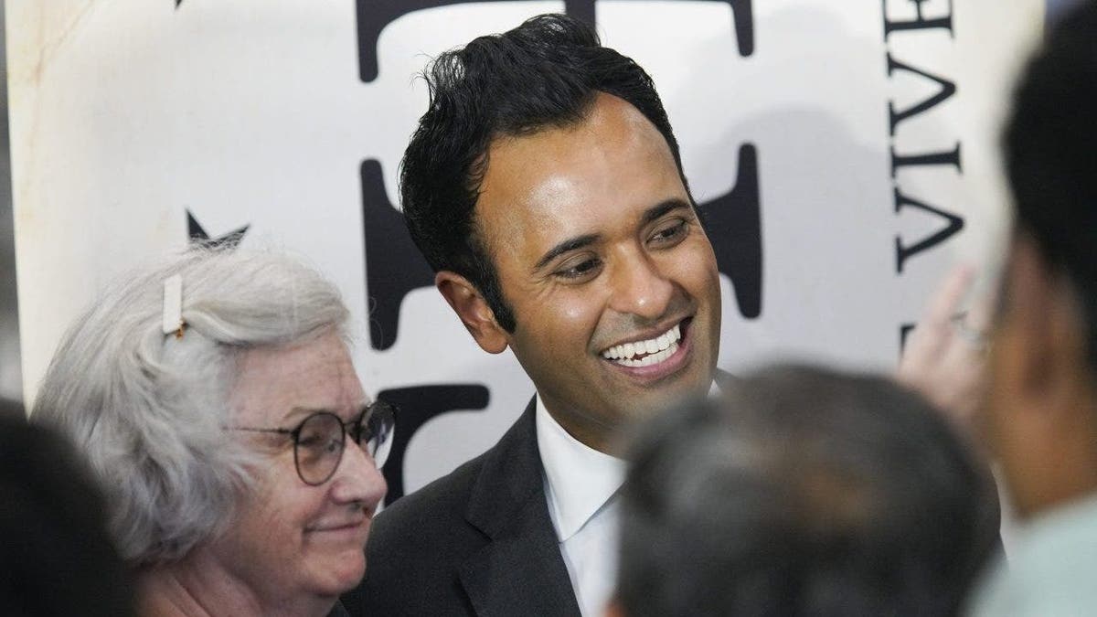 Vivek Ramaswamy greets voters at a campaign stop