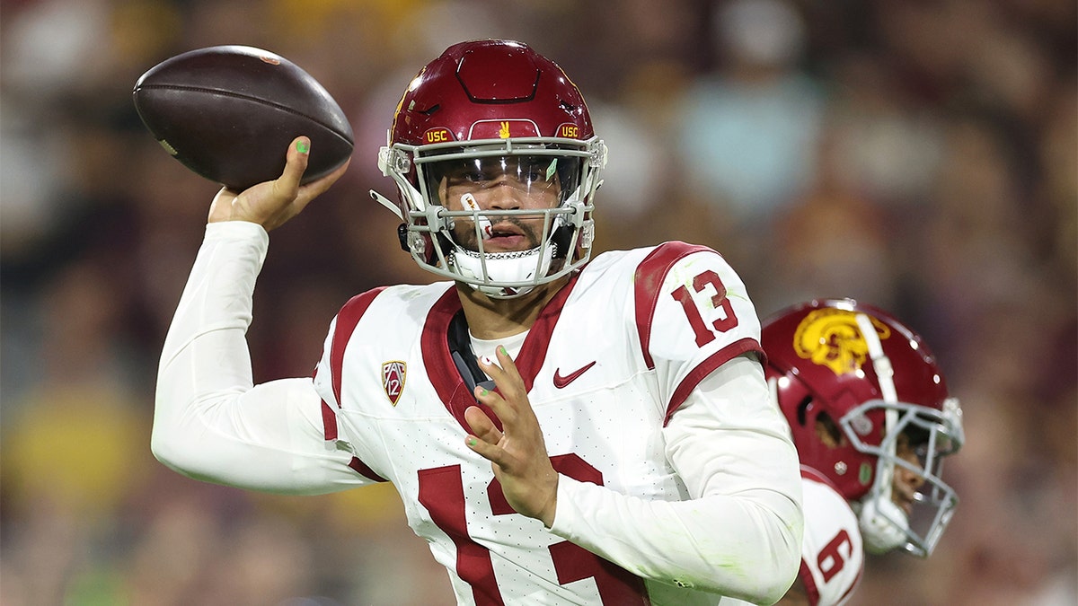 Caleb Williams throws against ASU