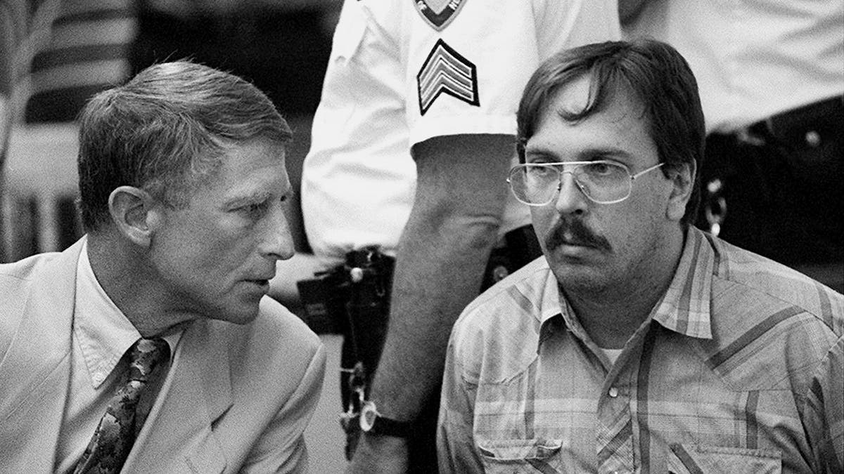 Joel Rifkin looking serious next to his lawyer in court