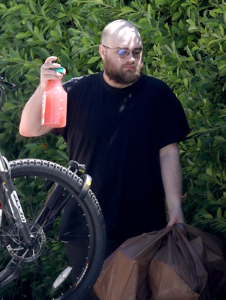Former child star Angus T Jones is seen in dramatic new photos looking totally unrecognizable and completely bald. The Two and a Half Men alum, who turns 30 on October 8, was pushing an electric bike that appeared to have a puncture in one of its tires whilst also unloading a bunch of groceries from his car. Angusâs rare public outing on the afternoon of August 28, 2023 was first time he has been seen since May this year and he appears to have trimmed his beard since then. He was also wearing eye glasses, a baggy black T-shirt and shorts.
