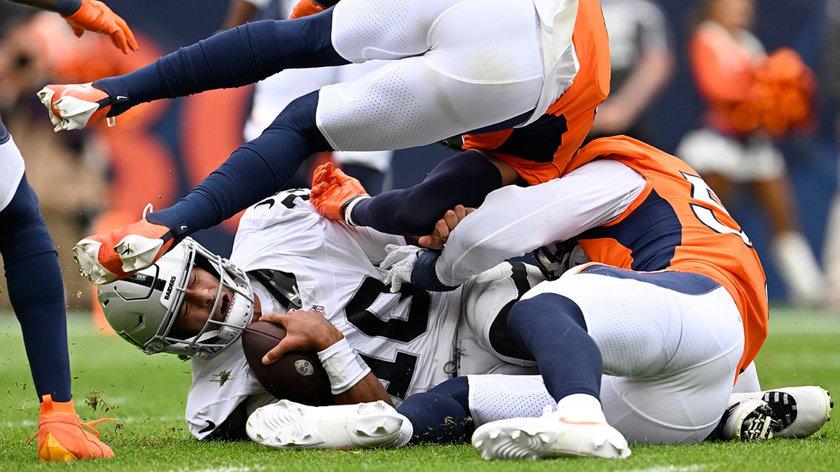 Broncos players tackle Jimmy G