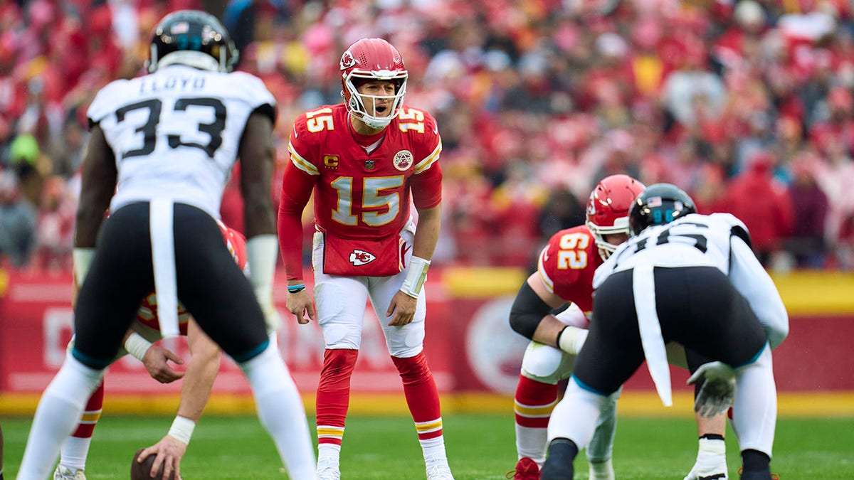 Patrick Mahomes calls a play during a game