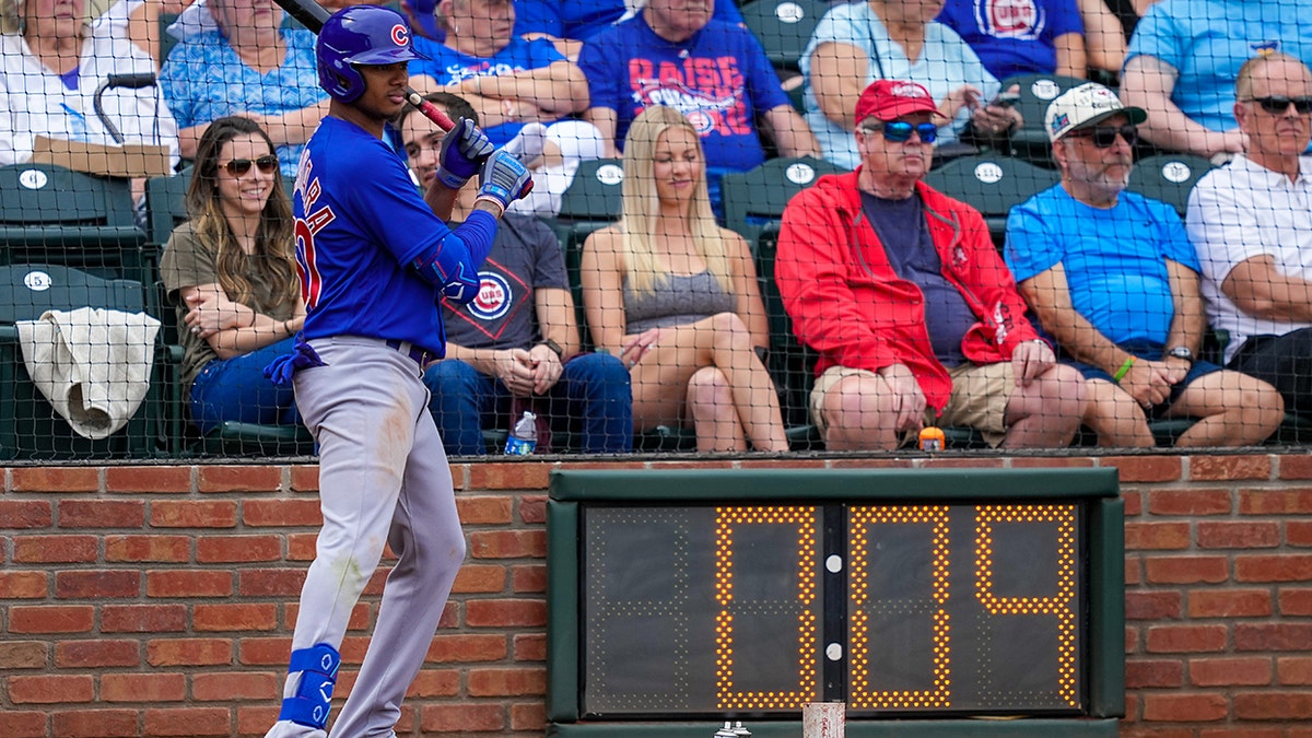 Sergio Alcantara of the Chicago Cubs stands in front of MLB pitch clock