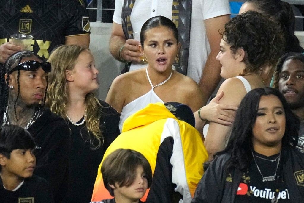 Entertainer Selena Gomez, center, is seen along with rapper Tyga, left, during the second half of a Major League Soccer match between Los Angeles FC and Inter Miami on Sept. 3, 2023, in Los Angeles.