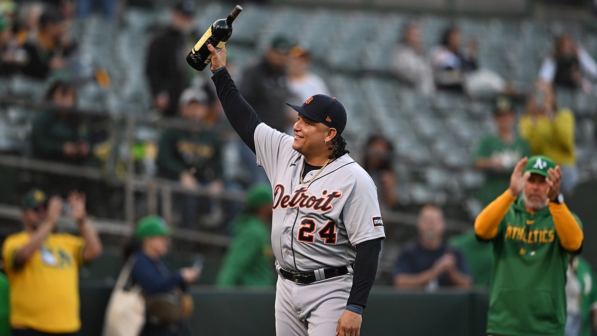 Miguel Cabrera shows wine to A's crowd