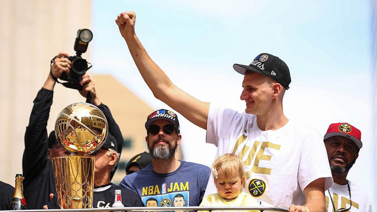 Nikola Jokic celebrates at a parade