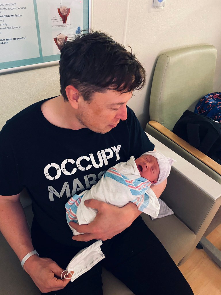 Elon Musk with his baby boy X.