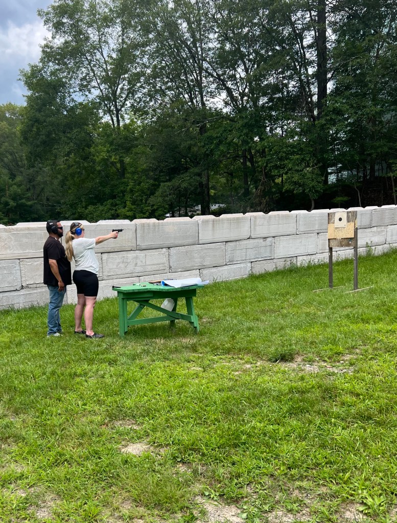Victoria Bonelli and instructor at firing range