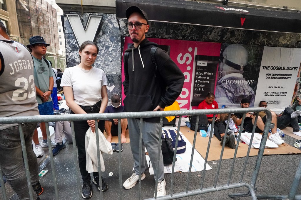 Russian migrant couple Natalia Subbotina and Maksim Subbotin outside of the shelter at the Roosevelt Hotel on August 2, 2023.