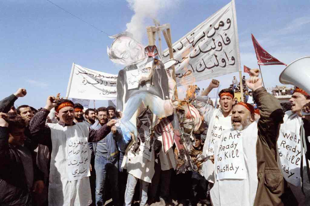 Pro-Iranian Hezbollah fundamentalists burn an effigy of Rushdie on Feb. 26, 1989, accusing him of blasphemy for his "Satanic Verses" book.
