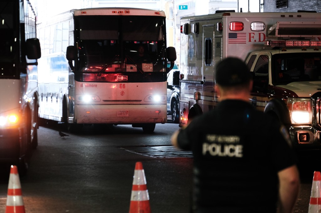 A migrant carrying-bus pulls into the Port Authority bus station in Manhattan on Aug. 25.